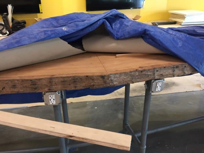 coquina club slab table 2 Heart Cypress Feature Walls and Paneling a Focal Point of University of South Florida’s Coquina Club